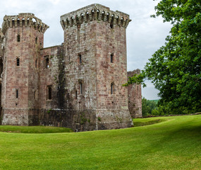 Fototapeta na wymiar Ramparts and towers of a ruined medieval castle (Raglan Castle, Wales)
