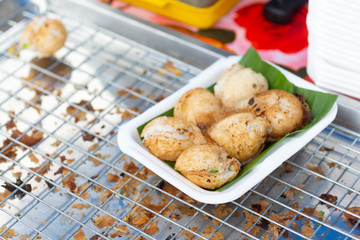 Sweet and Savory Grilled Coconut-Rice Hotcakes use name 'kanom krok' , sometimes use Coconut Rice Cake,Thai coconut pudding.