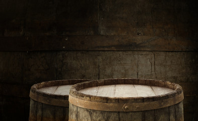 Fototapeta premium Beer barrel with beer glass on table on wooden background