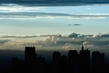 Obraz na płótnie Canvas 高層ビルのシルエットと空 High-rise buildings