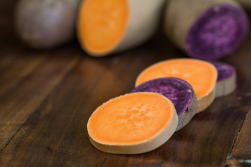 Fototapeta na wymiar Sweet Potatoes (Orange and Purple)