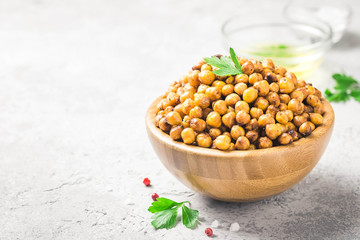 Vegan healthy snack,spicy roasted chickpeas in bowl. Selective focus, space for text.
