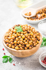 Vegan healthy snack,spicy roasted chickpeas in bowl. Selective focus, space for text.