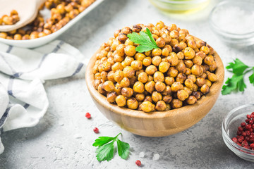 Vegan healthy snack,spicy roasted chickpeas in bowl. Selective focus, space for text.