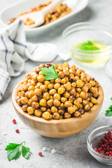 Vegan healthy snack,spicy roasted chickpeas in bowl. Selective focus, space for text.