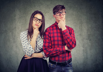 Skeptical young man and woman