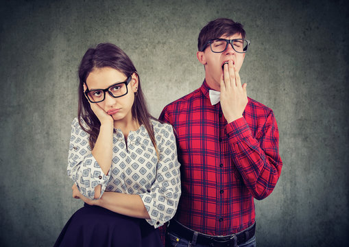 Young Couple Having Boring Date