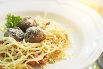 The spaghetti with meatball in serve with the cheese.The Italian traditional food.