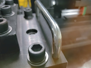 Close-up Fasteners on Blurred Background of Industrial Machinery