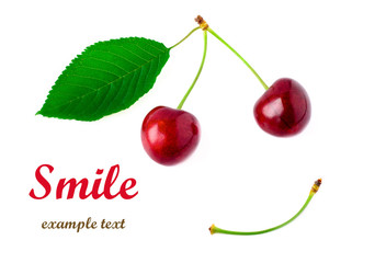 Two red cherries with a yellow green leaf on a white background. Smile concept. Don't worry Be Happy.