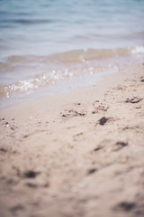 Beach sand overlooking small waves