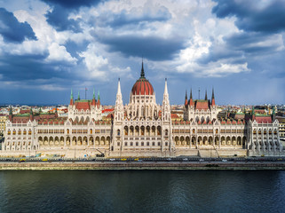 Fototapeta premium Budapest, Hungary - Aerial view of the Houses of Parliament building of Hungary at daytime with beautiful sky and clouds
