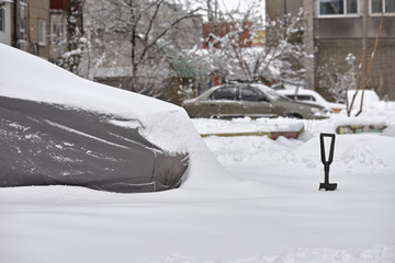 Gray tent protect car from winter snow storm