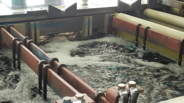 Galvanic bath, Engineering production. Circuit board in galvanic bath in the workflow