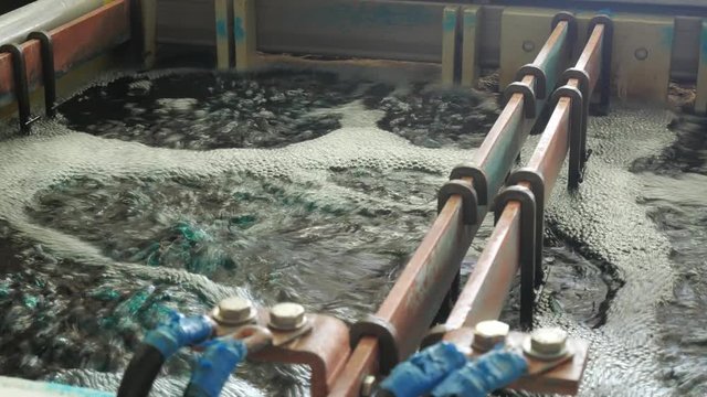 Galvanic bath, Engineering production. Circuit board in galvanic bath in the workflow