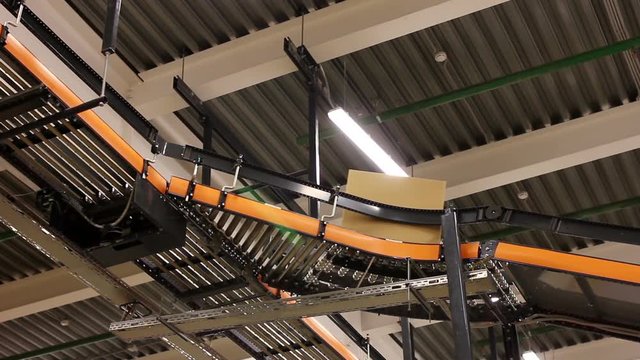 Sorting Parcels at Conveyor inside warehouse