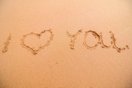 Sign "I love you" on the beach in Portugal