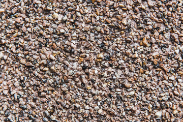 Concrete wall with small beige pebbles