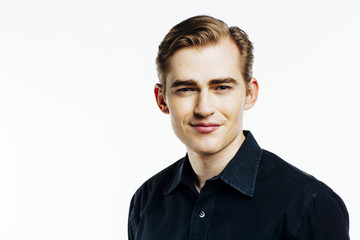 Portrait of a young expressive man on white studio background