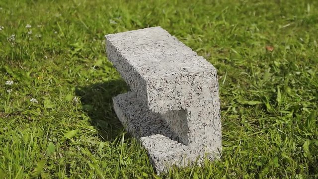 building cement block on grass