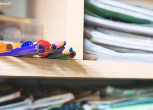 Multicolored Pencils In An Messy Wall Cabinet