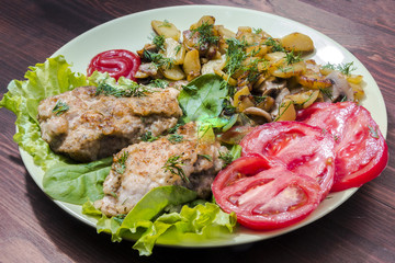 fried chicken with potatoes, mushrooms and chicken