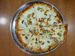 Tasty pizza on the metal tray