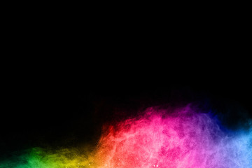 Multicolor powder explosion on black background. 