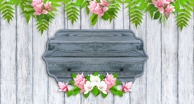 Magnolia flowers with wooden signboard  and place for your photo or text