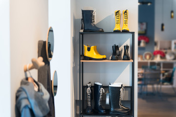 Stylish shelving with shoes and clothes in the apartments