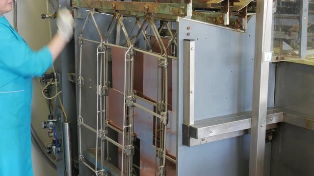 Circuit board manufacturing. Galvanic bath, Engineering production. Circuit board in galvanic bath in the workflow.