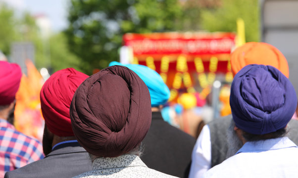 Sikh ethnic men wear colorful turbans to cover their hair