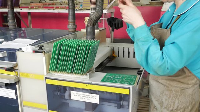 Circuit board manufacturing. Galvanic bath, Engineering production. Circuit board in galvanic bath in the workflow.
