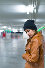 Portrait of beautiful asian woman at parking night scene,Thailand people