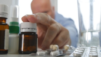 Fototapeta na wymiar Man Take Medicine Cure Choose Some Pills From the Table
