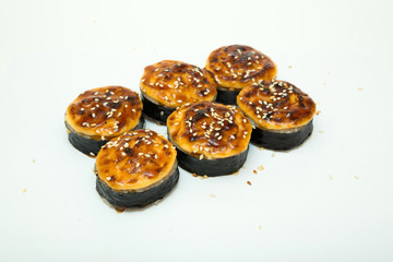 tasty fresh sushi rolls lying on a white background