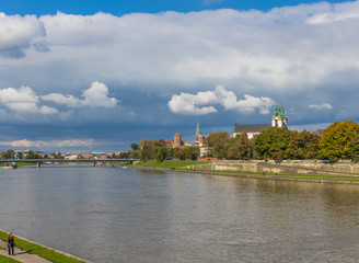 Fototapeta na wymiar Krakow, Poland - the second biggest city in Poland, Krakow offers a mix of history and modernity. Here in the picture a perspective of the Old Town see from the Vistula river, which cuts the city