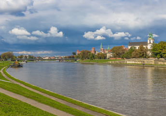 Krakow, Poland - the second biggest city in Poland, Krakow offers a mix of history and modernity. Here in the picture a perspective of the Old Town see from the Vistula river, which cuts the city