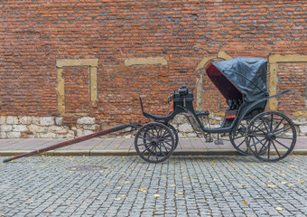 Fototapeta na wymiar Krakow, Poland - the second biggest city in Poland, Krakow offers a mix of history and modernity. Here in the picture a perspective of the Old Town, where horses are often used to carry tourists