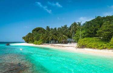 Fototapeta na wymiar Maldives beautiful beach background white sandy tropical paradise island with blue sky sea water ocean