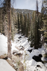 Fototapeta na wymiar A snow covered river near Vail, Colorado. 