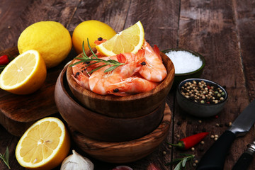 Raw fresh Prawns Langostino Austral. shrimp seafood with lemon and spices.