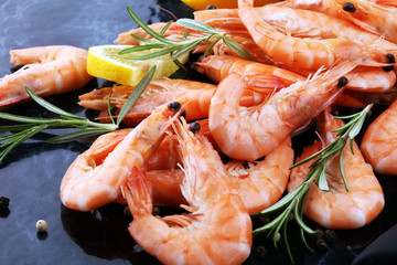 Raw fresh Prawns Langostino Austral. shrimp seafood with lemon and spices. - obrazy, fototapety, plakaty
