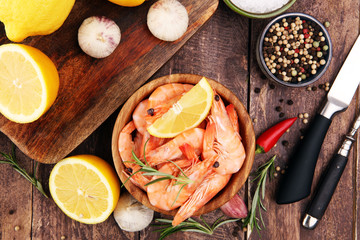 Raw fresh Prawns Langostino Austral. shrimp seafood with lemon and spices.