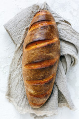Freshly baked artisanal loaf of wheat flour.