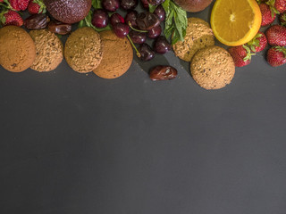 overhead flat lay of delicious fresh raw fruits and berry with sweet cookies mockup copy space