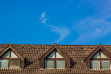 vintage building top facade and blue sky background concept with empty space for copy or text
