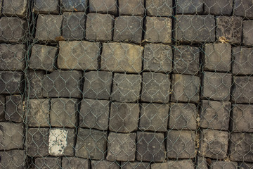 grey stones wall background texture with empty space for copy or text