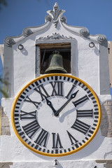 Close up of christian church clock tower