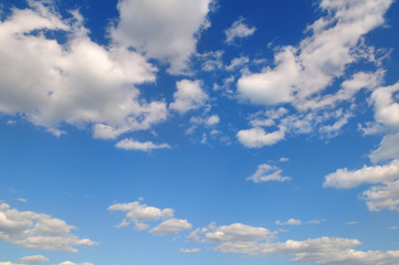 cumulus clouds in the blue sky. A bright sunny day